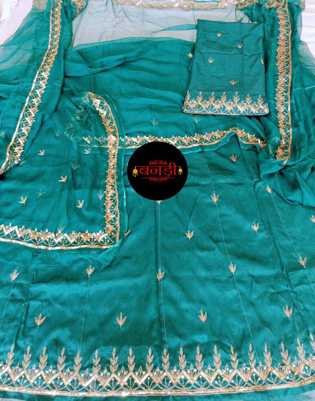 Upada Suit in Rama Green Color with Jodhpur Tikli Mix Handwork